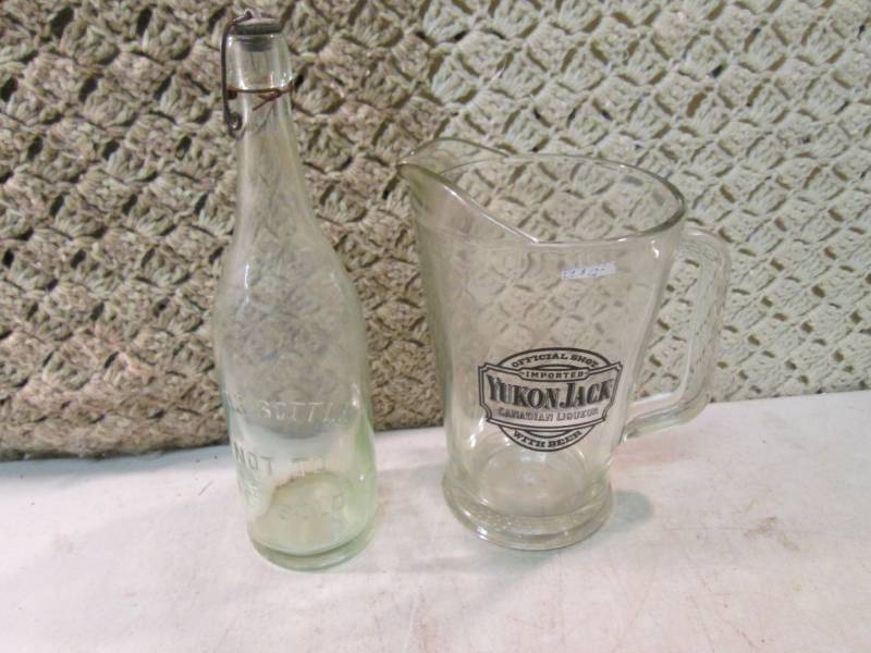 lot 100 image: Yukon Jack Glass Pitcher and Vintag...