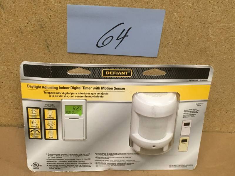 lot 64 image: Defiant 8 Amp 7-Day Indoor In-Wall SunSmart Digital Timer Switch with Motion Sensor, White in good condition