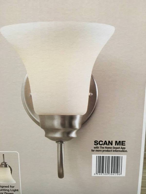 lot 30 image: Commercial Electric 1-Light Brushed Nickel Sconce with Frosted White Glass Shade n good condition