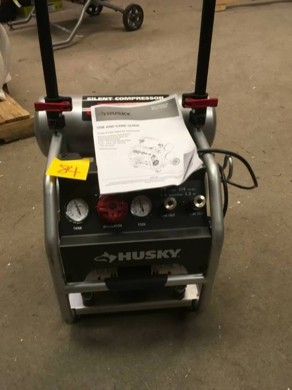 lot 84 image: Husky 4.5 Gal. Portable Electric-Powered Silent Air Compressor in working conditions