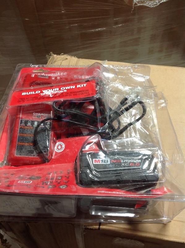 lot 107 image: MILWAUKEEM18 REDLITHIUM XC5.0 and charger in very good condition