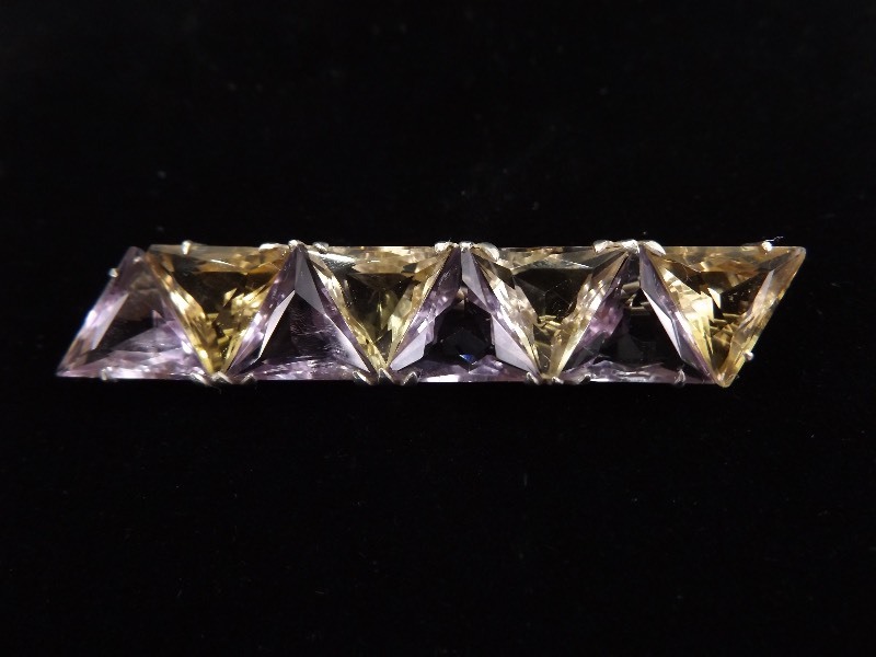 lot 91 image: .925 Sterling Silver Triangle Faceted Amethyst and Citrine Brooch