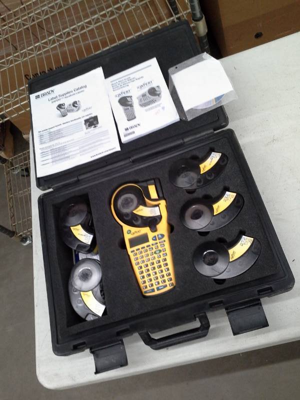 lot 678 image: Brady Label Supplies Catalog IDXPERT Handheld Labeler with Case, Manuals