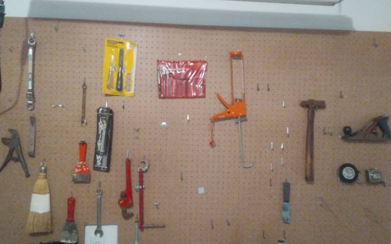 lot 45 image: Wall Of Tools-Extension Cord, Screwdrivers With Rack, Plane, Hex Key Set, Pipe Wrench, Vise Grip, Tape Measure, More.