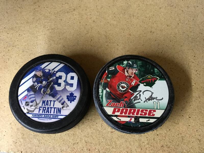 Matt Frattin Puck & Zach Parise Puck