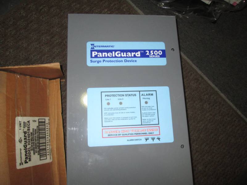 lot 55 image: Panel Guard surge protector...