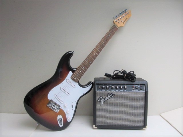 lot 38 image: Johnson Electric Guitar wFender Amplifier
