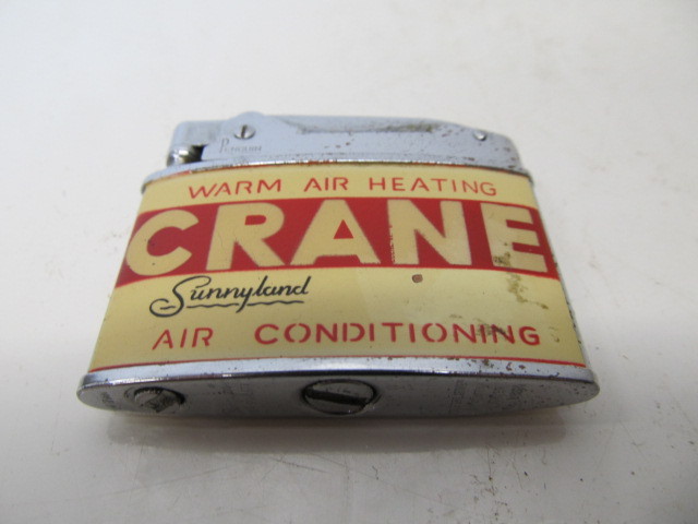 lot 206 image: Vintage Crane Advertising Cigarette Lighter