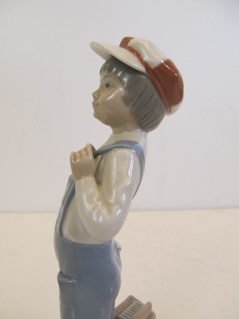 lot 193 image: Genuine LLADRO Porcelain Figurine - Boy wSqueezebox