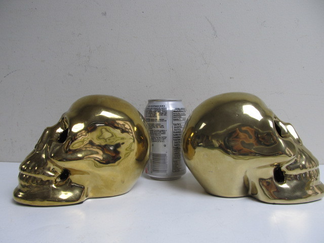 lot 178 image: Pair of Gold Ceramic Skull Statues