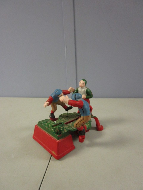 lot 377 image: VINTAGE CAST IRON MECHANICAL BANK