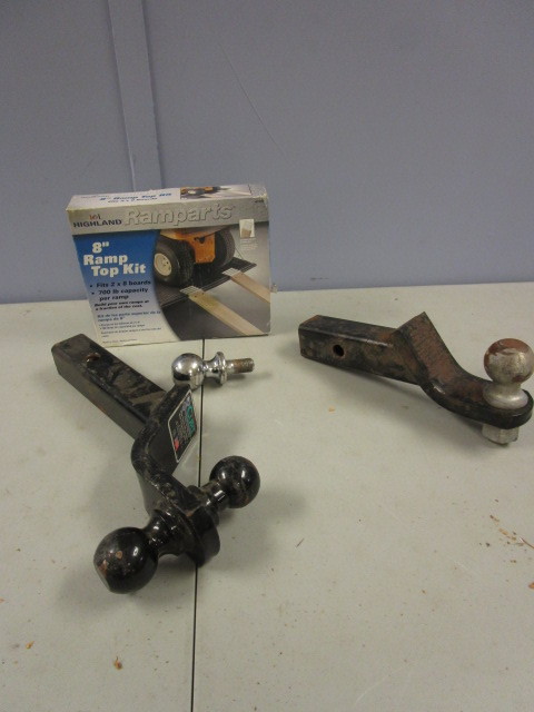 lot 402 image: TRAILER HITCH BALLS AND TAILGATE RAMP ENDS