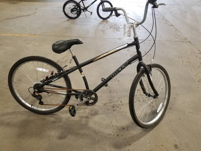 lot 457 image: Huffy, black bike with white and gold Huffy, 6 speed, 21  Inch Rim Diameter