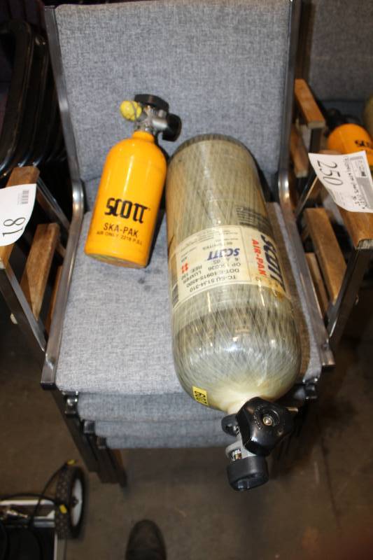 lot 18 image: Scott Air-Pak Safety Air 60 Minute Carbon Fiber Air Bottles and Ska-Pak 5 Minute Spare Bottles