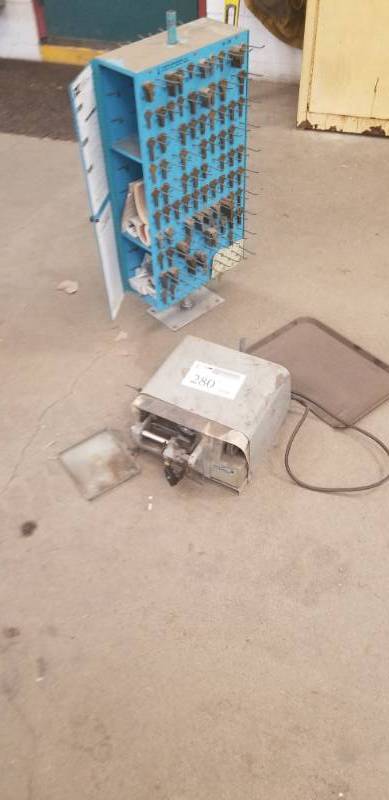 lot 280 image: Curtis Industries Model 3000 Automatic Key Cutting Machine with Key Blanks on Storage Cabinet