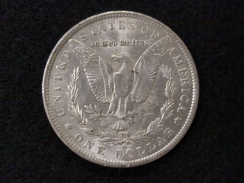 lot 5 image: 1885 O Morgan Silver Dollar...