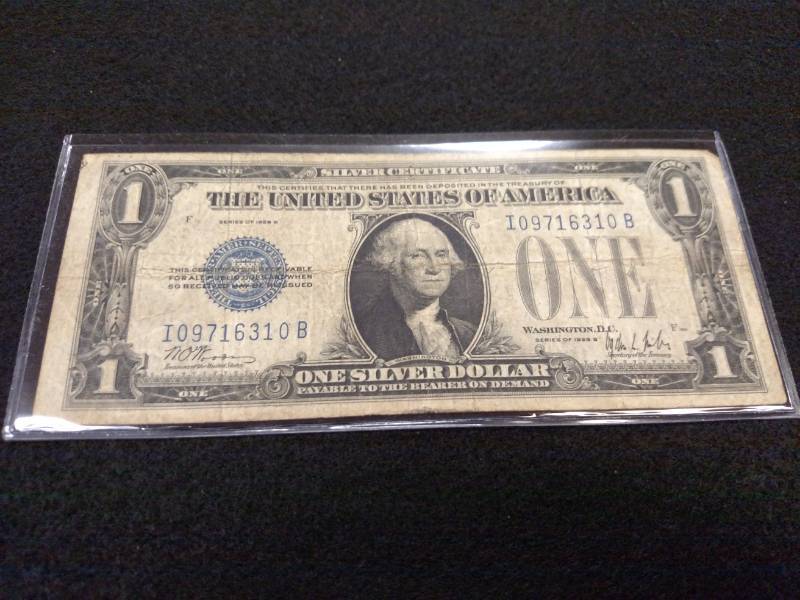 lot 100 image: 1928 B Funny Back One Dollar Silver...