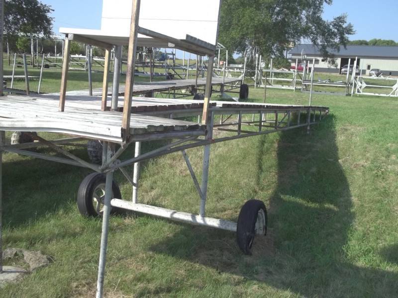 lot 50 image: 38 x 42 Steel Roll in dock, w 8 T and 2 benches. Wood treated decking