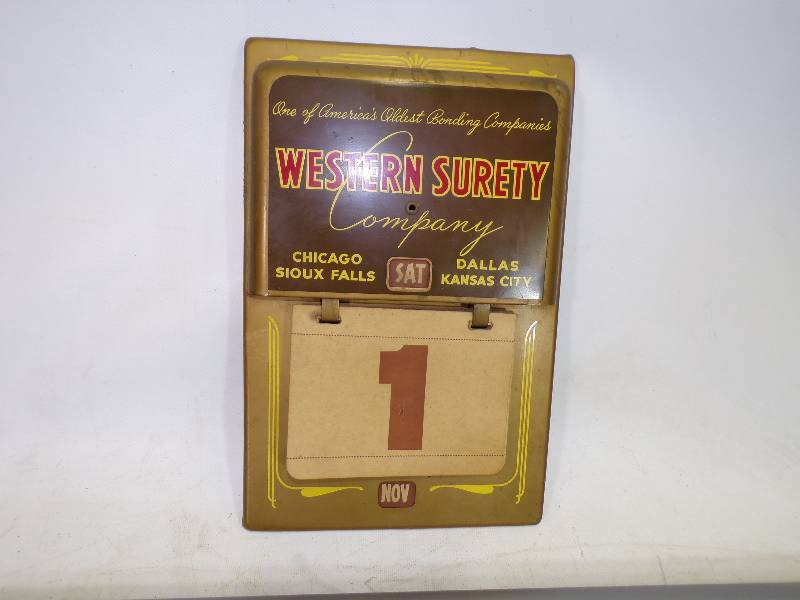 lot 31 image: Vary Rare Tin Western Surety Company Calendar, Complete 