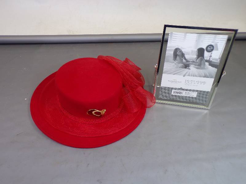 lot 85 image: Red Hat  and Broach, Double Glass Picture Frame