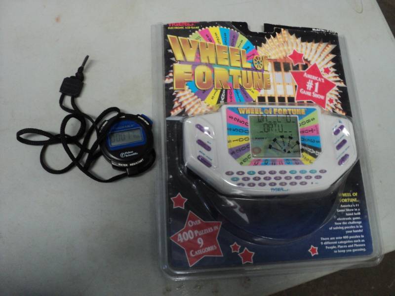 lot 221 image: Wheel of Fortune Game and Stopwatch...