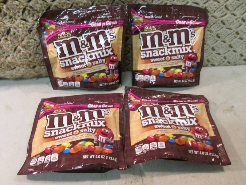 lot 56 image: 4 Bags of M&Ms Snack Mix Sweet & S...