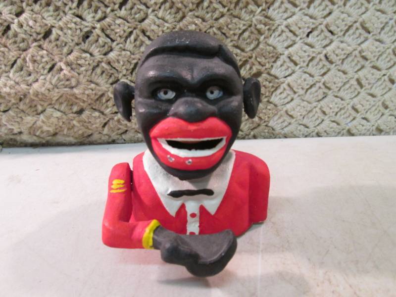 lot 250 image: Cast Iron Manual Animated Bank Pres...