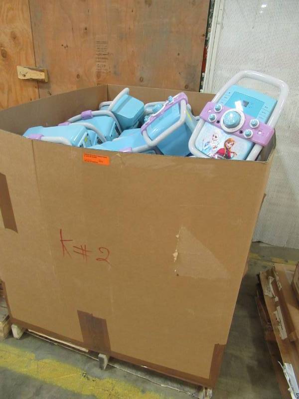 lot 148 image: Wholesale Pallet of Vivitar DISNEY FROZEN Elsa & Anna Colorful Flashing Lights Bar Karaoke Machines - Missing Microphones and other parts.