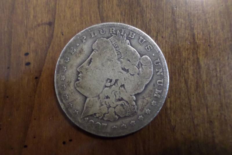 lot 79 image: 1887-O Morgan Silver Dollar