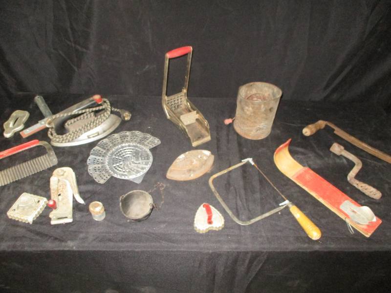 lot 63 image: Vintage items Cooking items, sifter, frenchfry cutter, saw and lots of rustic items old ireons