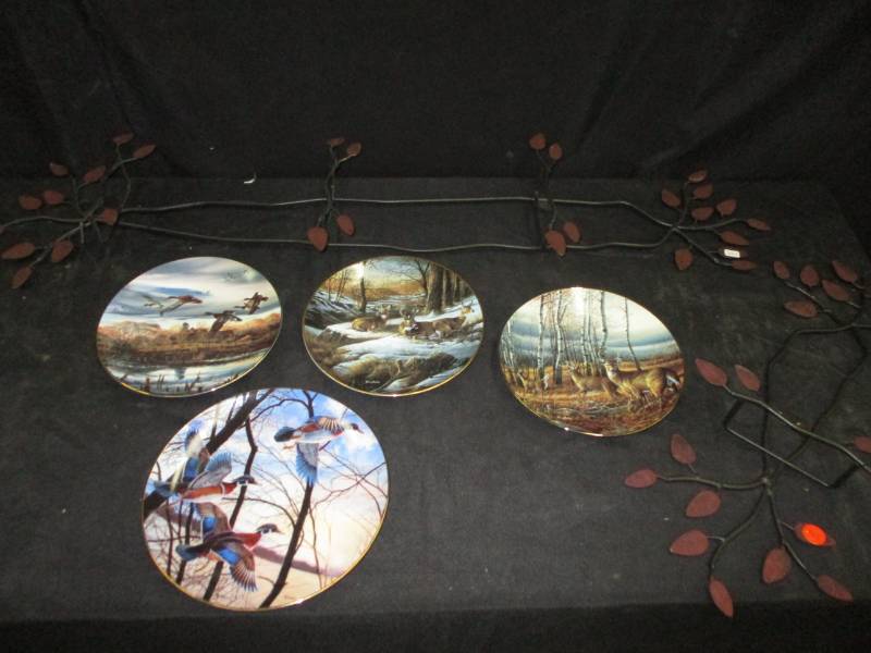 lot 94 image: 3 Terry Redlin plates and a Wild Wings plate with Metal Plate Rack Holder for your weall