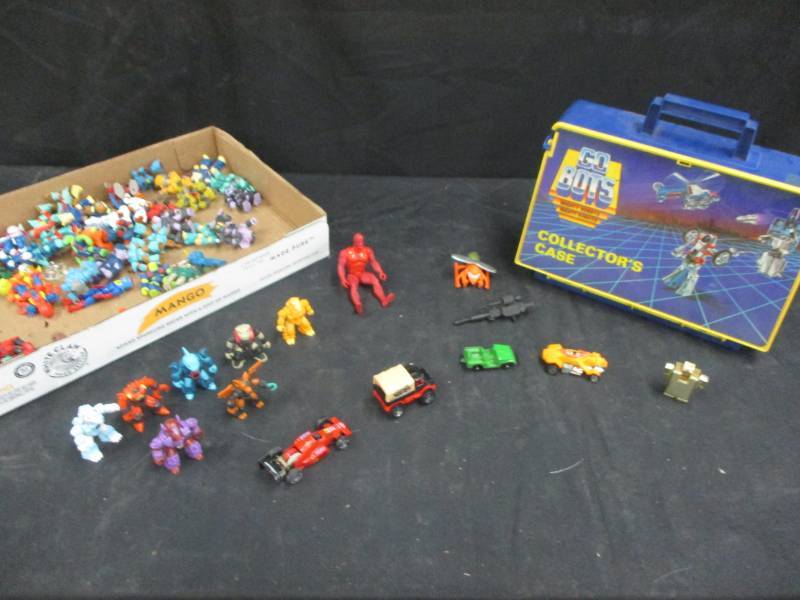 lot 116 image: Assorted collector toy figures and Mighty Go Bots Collectors case