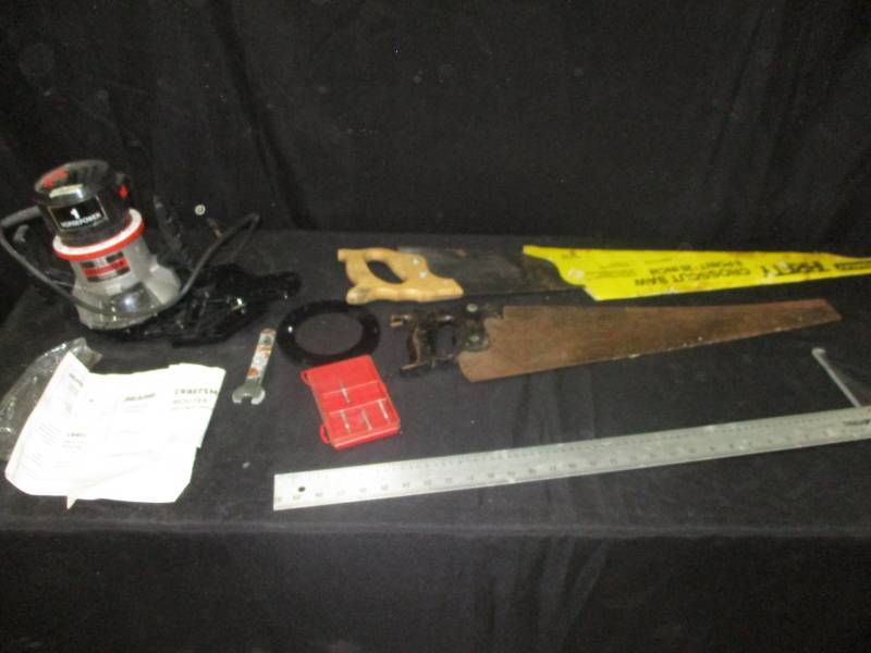 lot 137 image: 2 Saws, a drywall square and a nice 1 HP Router