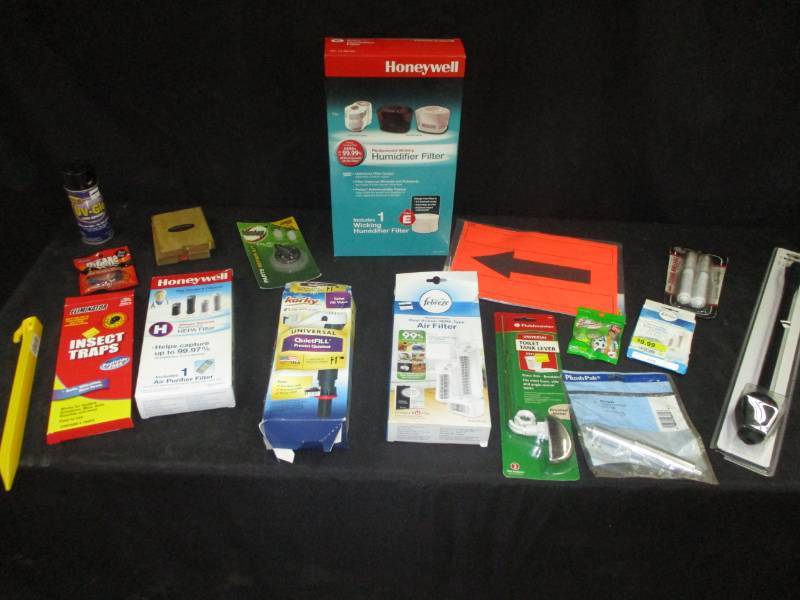 lot 191 image: Honeywell hepa filters, arrow signs, insect traps, quiet fill for your toilet, toilet paper holder things and more