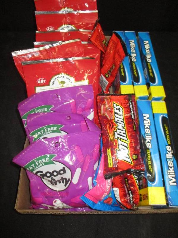 lot 204 image: 22 packs of a variety of licorice, hot tamalles, mike and ikes and more