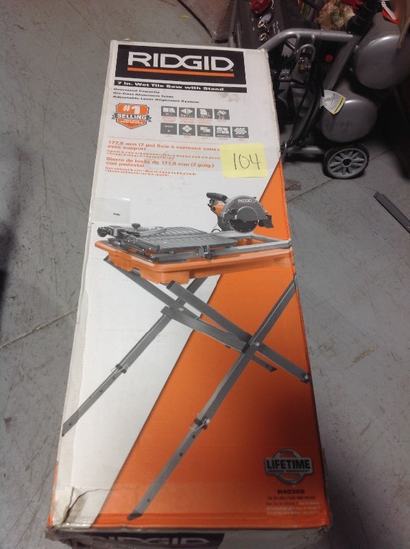lot 104 image: RIDGID 7 in. Tile Saw with Stand in good conditions