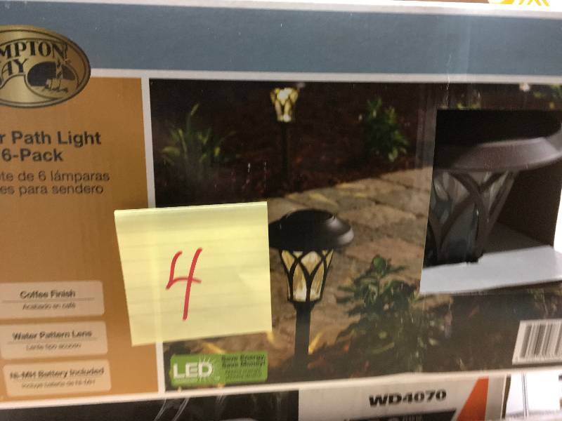 lot 4 image: Hampton Bay Solar Bronze Outdoor Integrated LED Landscape Fan Cage Path Light with Water Glass Lens (6-Pack) not used