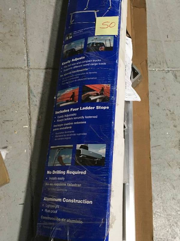 lot 50 image: Werner 800 lbs. Load Capacity Aluminum Universal Truck Rack custumer returns missing 3 small pcs stock photo used to display unit in good condition