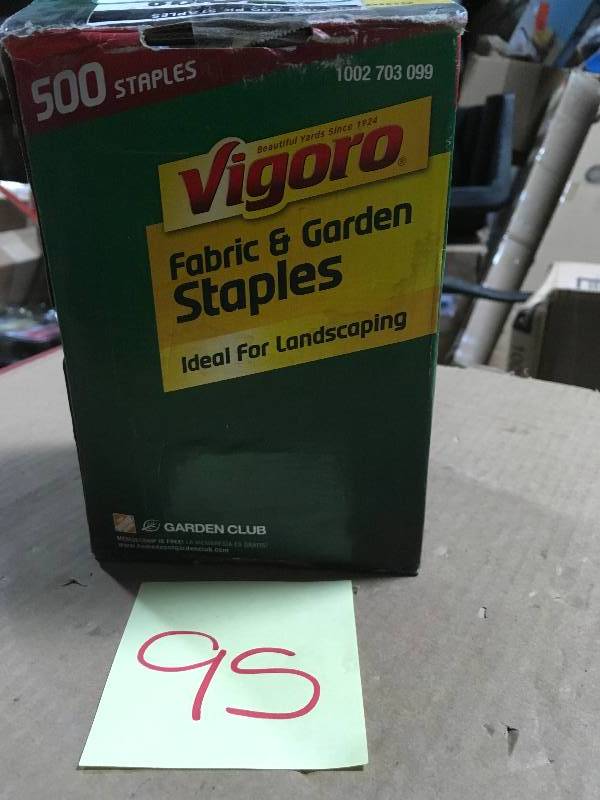 lot 95 image: Vigoro 4 in. Weed Barrier Landscape Fabric Garden Staples (500-Pack) not used