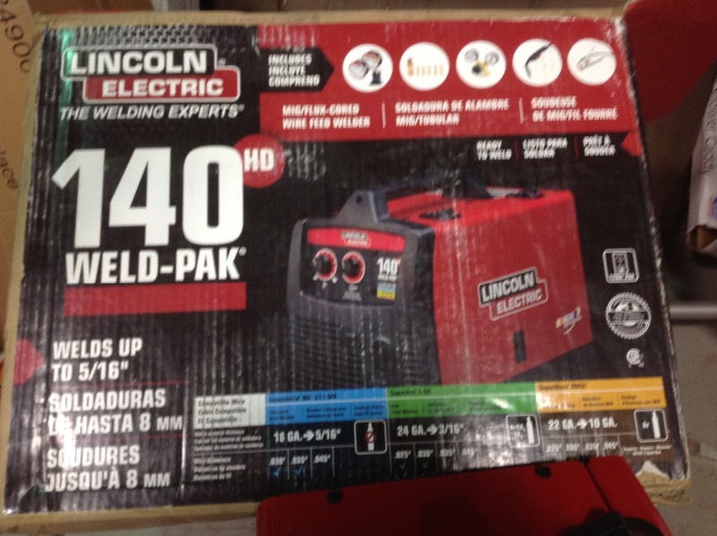 Lincoln Electric 140 Amp Weld Pak 140 HD MIG Wire Feed Welder with Magnum 100L Gun, Sample spools of MIG Wire and Flux Wire, 115V used in working conditions missing small accessories and one glass for the regulator are broken