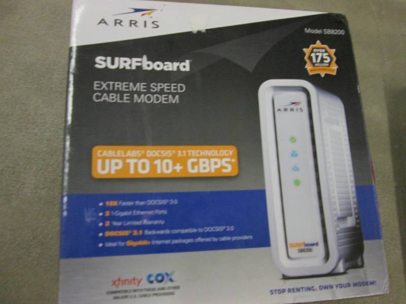 lot 141 image: Arris Surfboard Cable Modem...