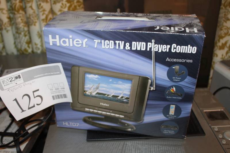 lot 125 image: Haier 7-inch LCD TVDVD Player Combo