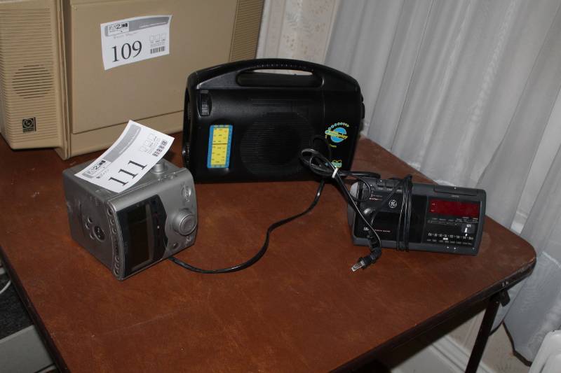 lot 111 image: Portable Radios - RCA AMFMCD, GE AMFMCassette, BayGen FreePlay Wind-Up Radio