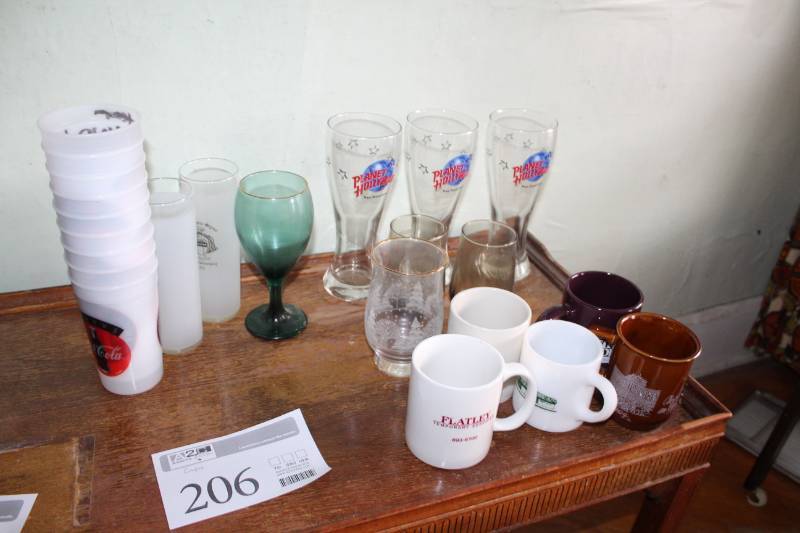 lot 206 image: Plastic Cups, Planet Hollywood Glasses, Ceramic Mugs, Bar Glasses, And More