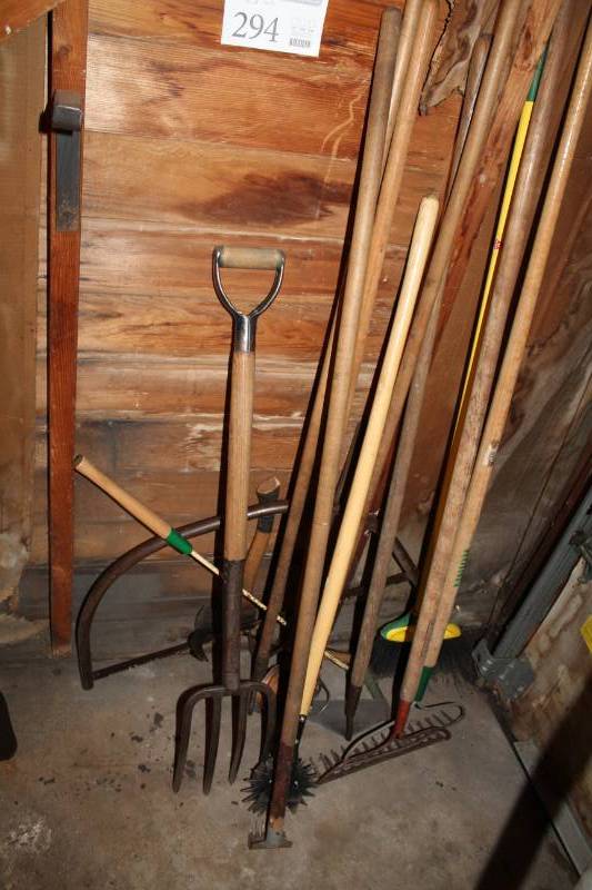 lot 294 image: Rakes, Pitchfork, Hoe, Edger, Wood Saw, And More
