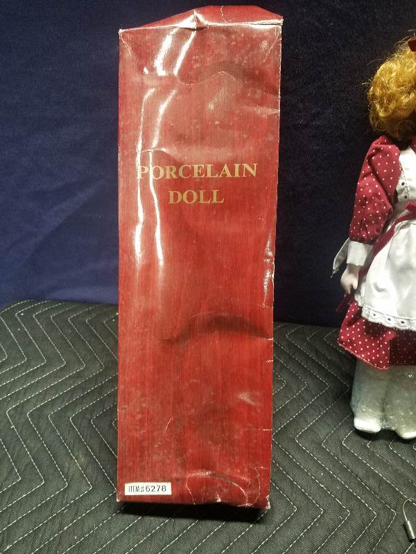 lot 114 image: Collectible Doll