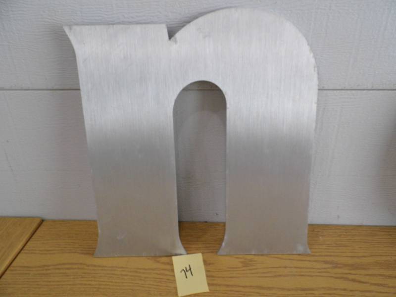 lot 74 image: Aluminum Letter n