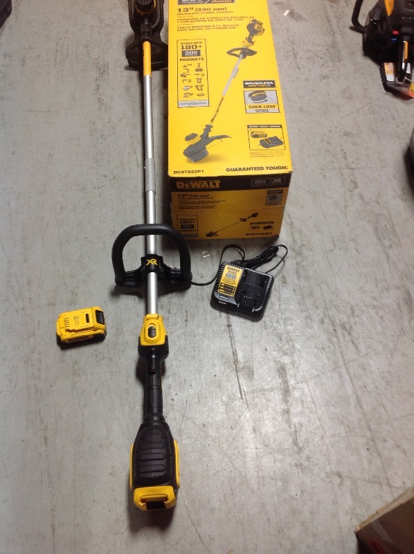 lot 106 image: DEWALT 20-Volt MAX Lithium-Ion Cordless 13 in. Brushless Dual Line String Grass Trimmer with 5.0Ah Battery and Charger Included in working conditions