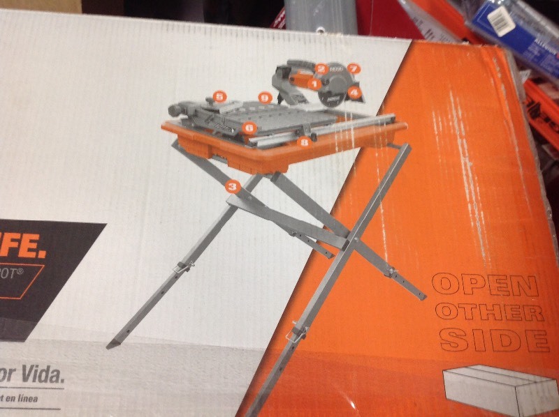 lot 104 image: RIDGID 9 Amp Corded 7 in. Wet Tile Saw with Stand in good conditions