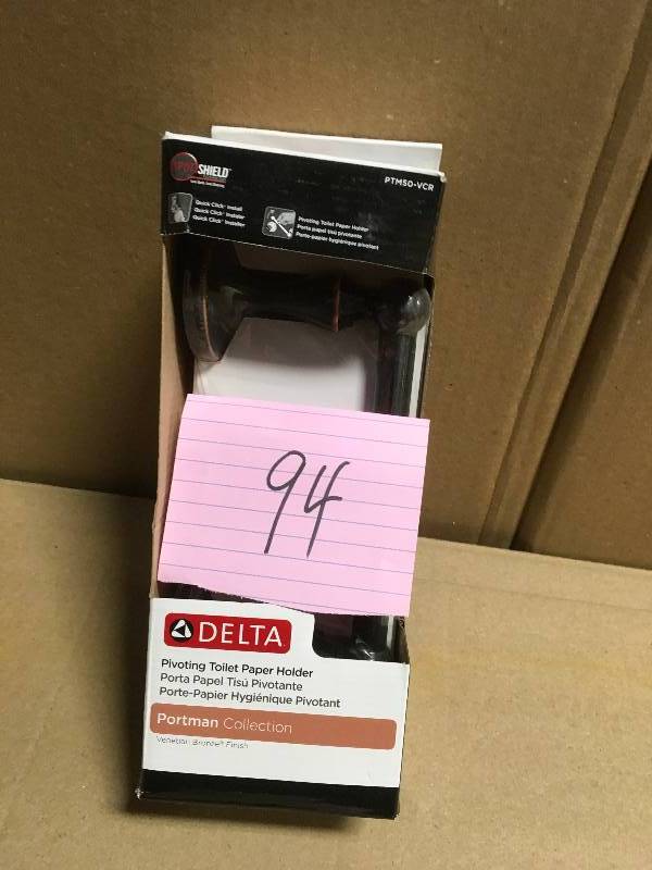 lot 94 image: Delta Portman Pivoting Toilet Paper Holder in Venetian Bronze with Copper Reveal in good condition